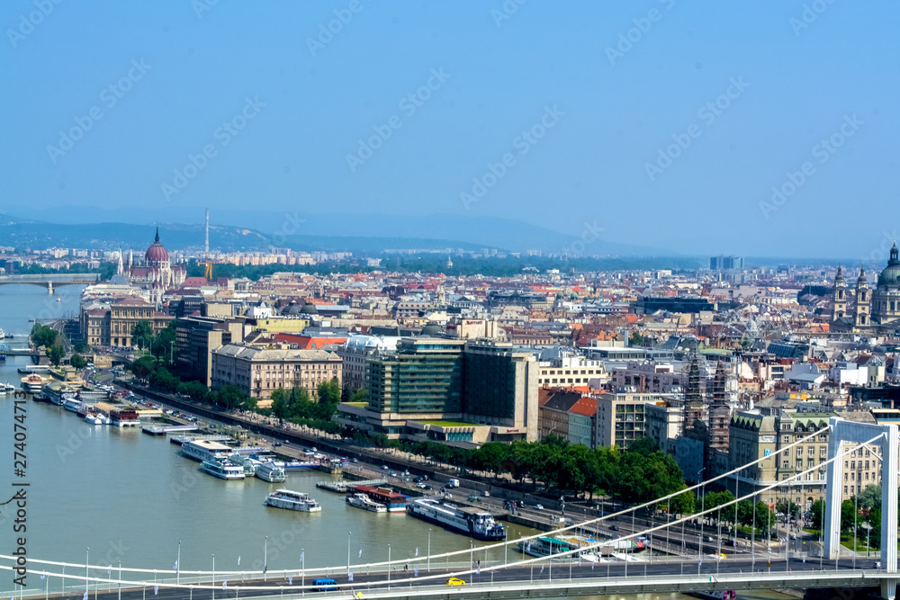 12.06.2019. Budapest, Hungary. A view of the new, wide and modern bridge through the Danube River of white color. Traffic intersection. Cars.
