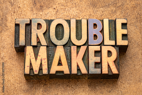 troublemaker word in wood type