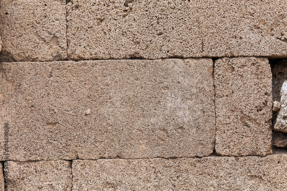 Fototapeta premium Background of ancient stone wall of a greek temple