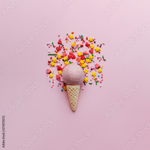 Ice cream on pastel colorful background with sweet glitter. Minimal summer concept. Flat lay.