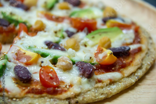  Italian pizza, vegetables, ingredients background. Pizza is cooking in the oven