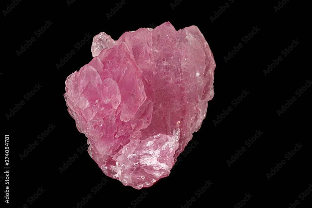 Macro pink quartz mineral stone on black background Macro pink quartz mineral stone on black background