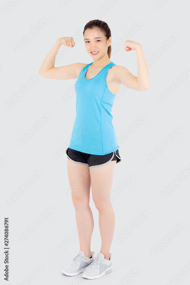 Beautiful portrait young asian woman wear sport clothes have strong and muscle with health, girl show biceps with exercise and workout for wellness isolated on white background, strength concept. Beautiful portrait young asian woman wear sport clothes have strong and muscle with health, girl show biceps with exercise and workout for wellness isolated on white background, strength concept.