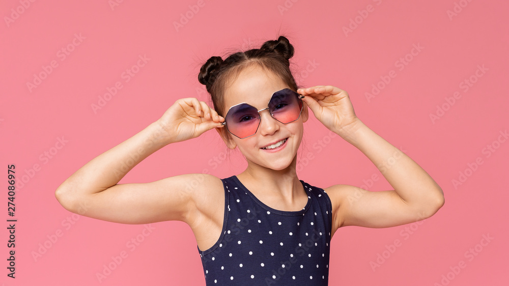 Cute little girl in stylish sunglasses enjoying summer time Cute little girl in stylish sunglasses enjoying summer time