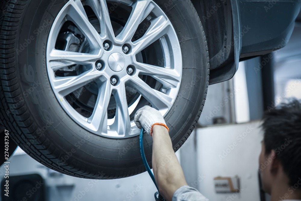 Car repairmen are testing tires