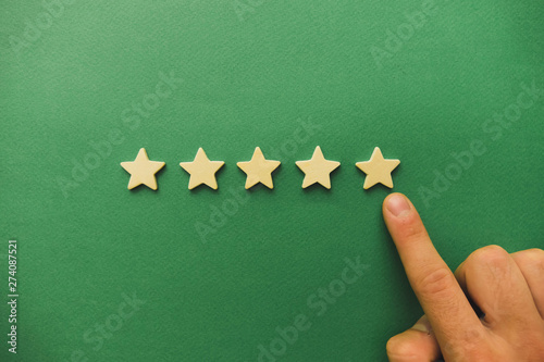 five white stars on a green background