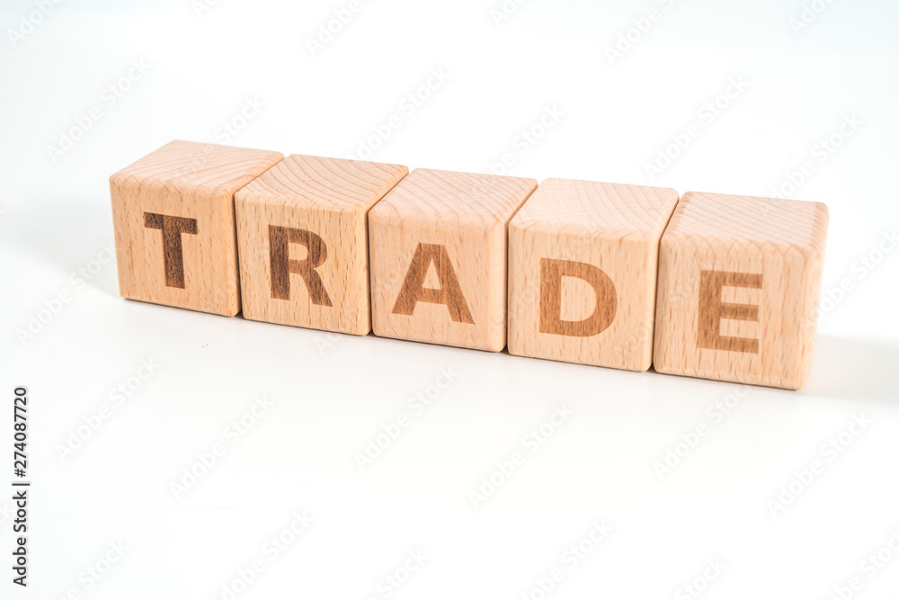 word TRADE on wood cube dices on white background. word TRADE on wood cube dices on white background.