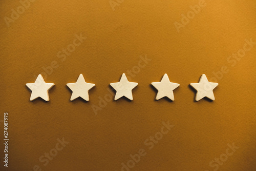 five white stars on an orange background