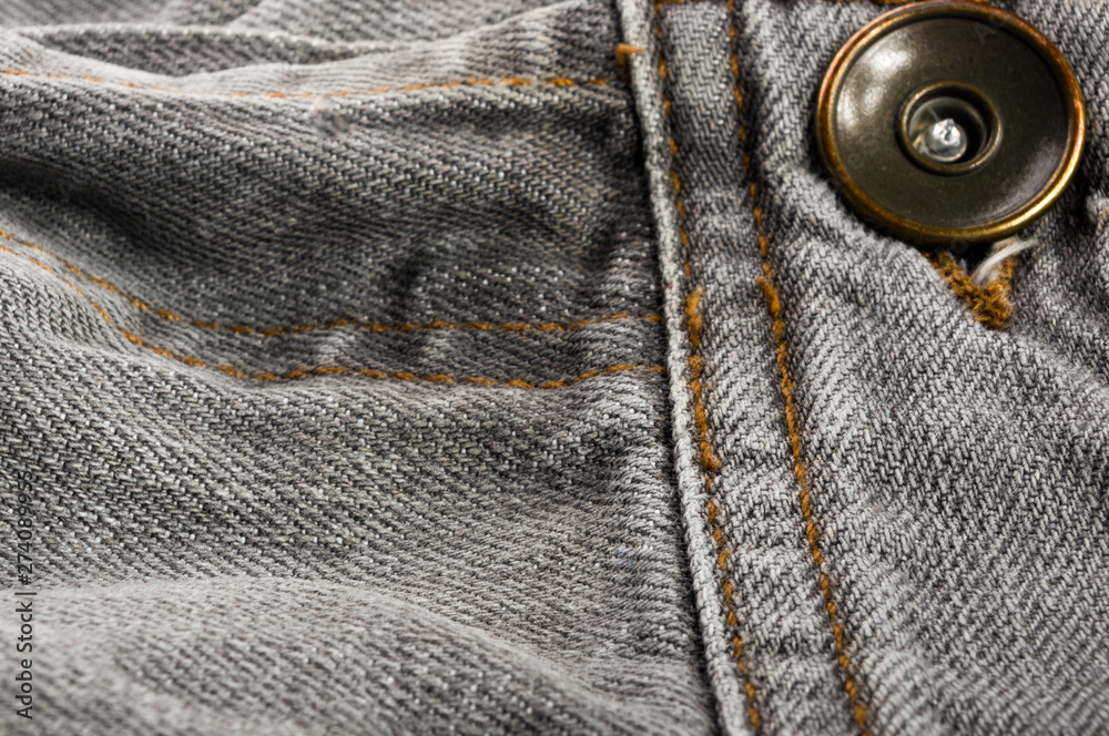 clothing items stonewashed cotton fabric texture with seams, clasps, buttons and rivets, macro clothing items stonewashed cotton fabric texture with seams, clasps, buttons and rivets, macro