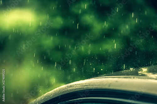 Rain splash on the roof of a car