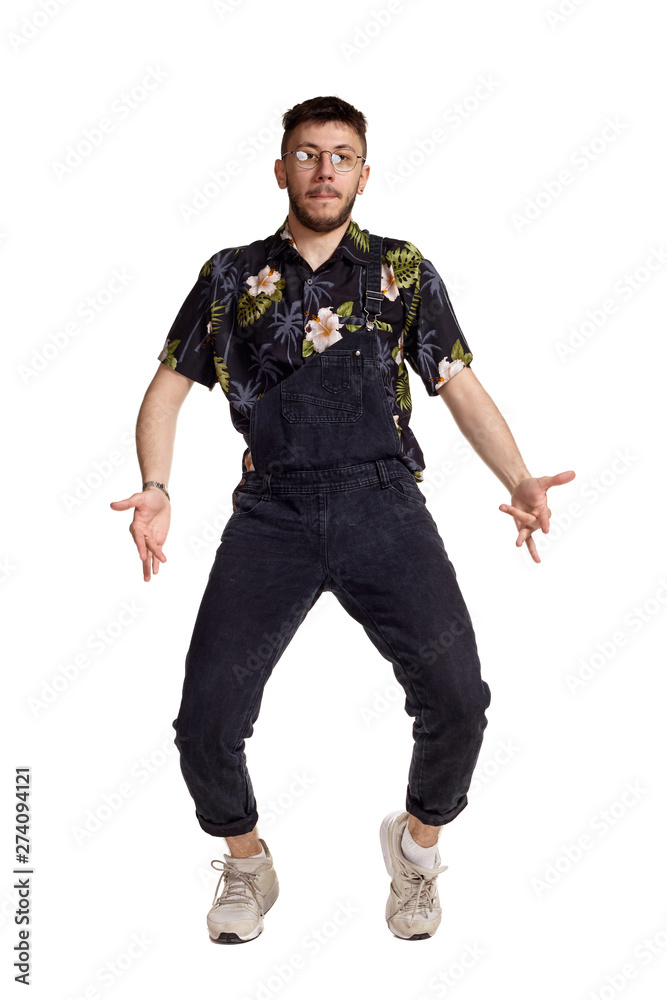 Full-length portrait of a funny guy dancing in studio isolated on white background. Full-length portrait of a funny guy dancing in studio isolated on white background.
