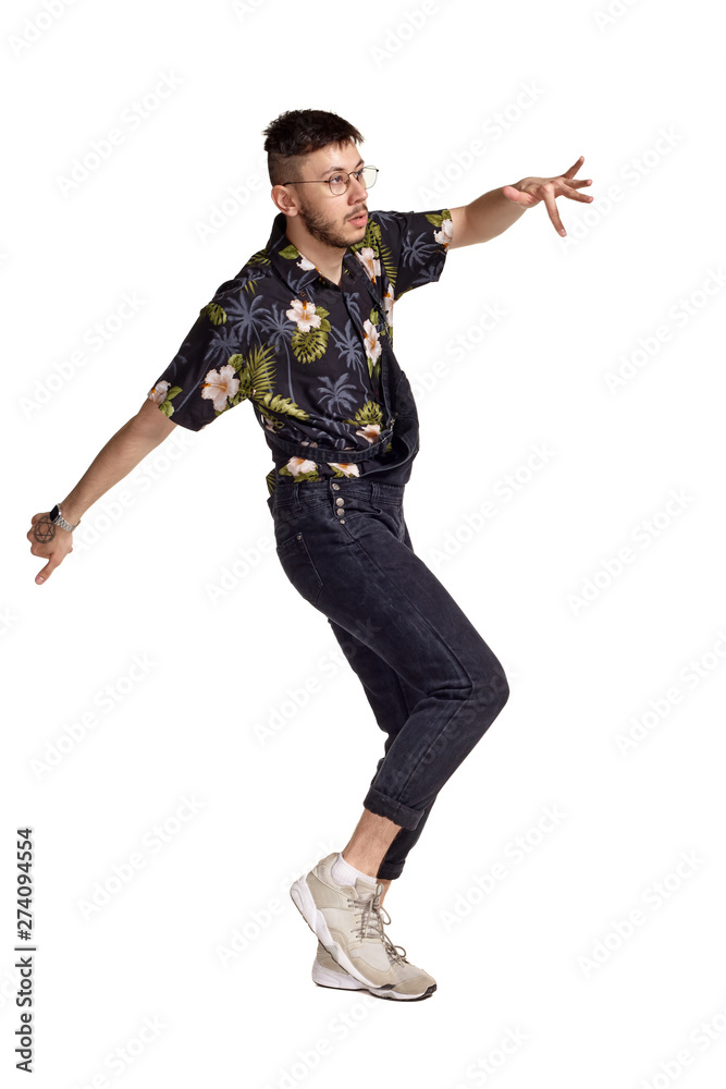 Full-length portrait of a funny guy dancing in studio isolated on white background. Full-length portrait of a funny guy dancing in studio isolated on white background.