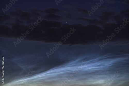 Fototapeta Naklejka Na Ścianę i Meble -  Noctilucent clouds closeup summer night.