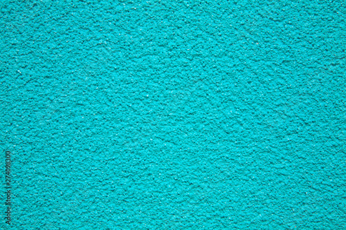 Turquoise painted stippled wall full frame