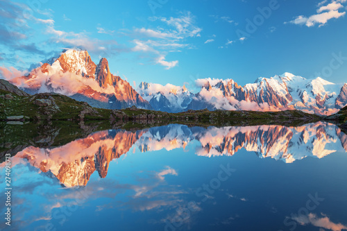 Sunset panorama of the Lac Blanc lake with Mont Blanc (Monte Bianco) on background in Chamonix location. Beautiful outdoor scene in Vallon de Berard Nature Reserve, France