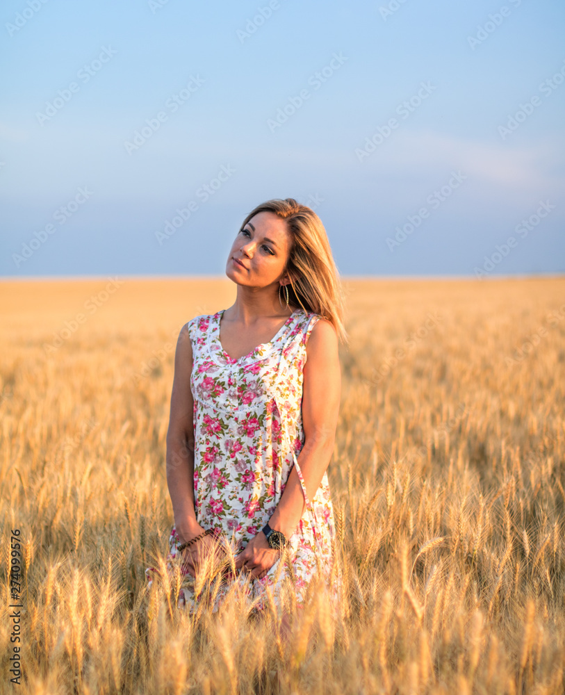 young seductive rural blond hair woman in dress on the yellow wheat field on the sunset young seductive rural blond hair woman in dress on the yellow wheat field on the sunset