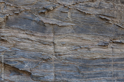 Textura de pedra natural. Superfície texturizada de rocha natural, onde se podem ver as linhas desenhadas na rocha ao longo do tempo. Pode ser usada como fundo.