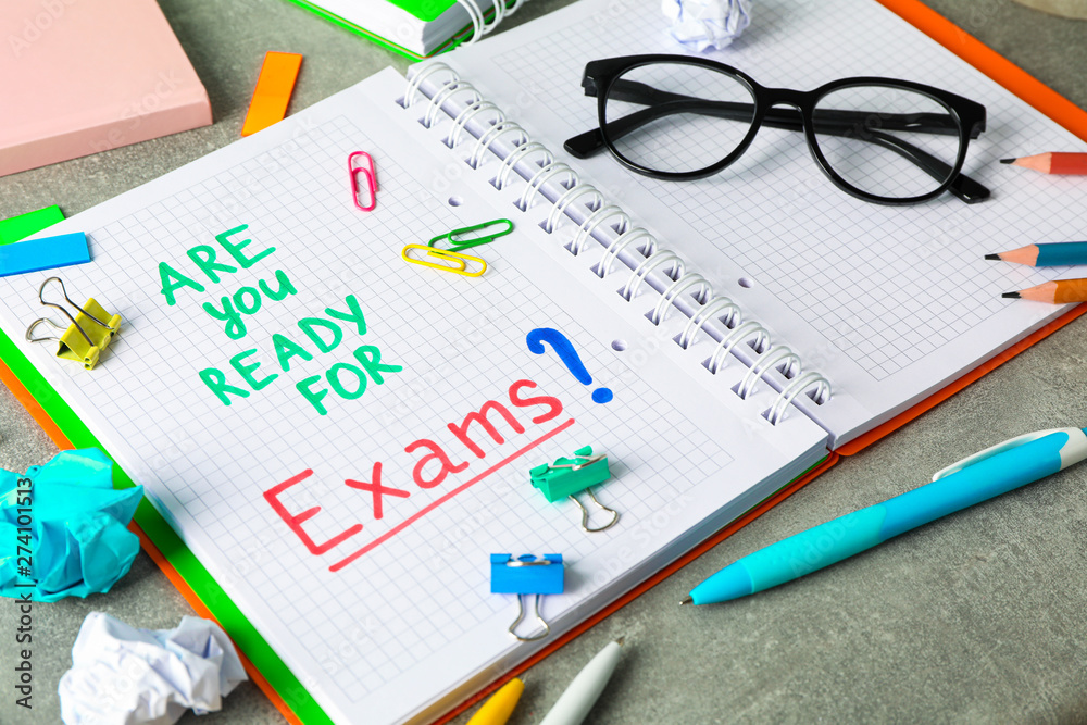 Composition with school supplies on grey background, space for text Composition with school supplies on grey background, space for text