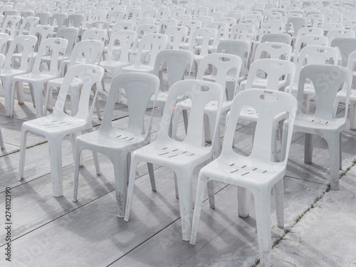 White plastic chairs in outdoor event