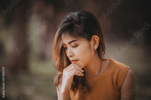Beautiful thai woman very sad from unrequited love rethink think over vintage style dark tone broken heart asian girl