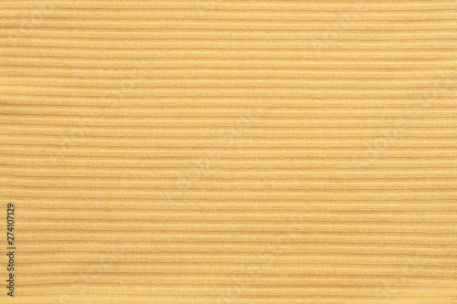 Closeup abstract pattern at yellow women's clothing textured background