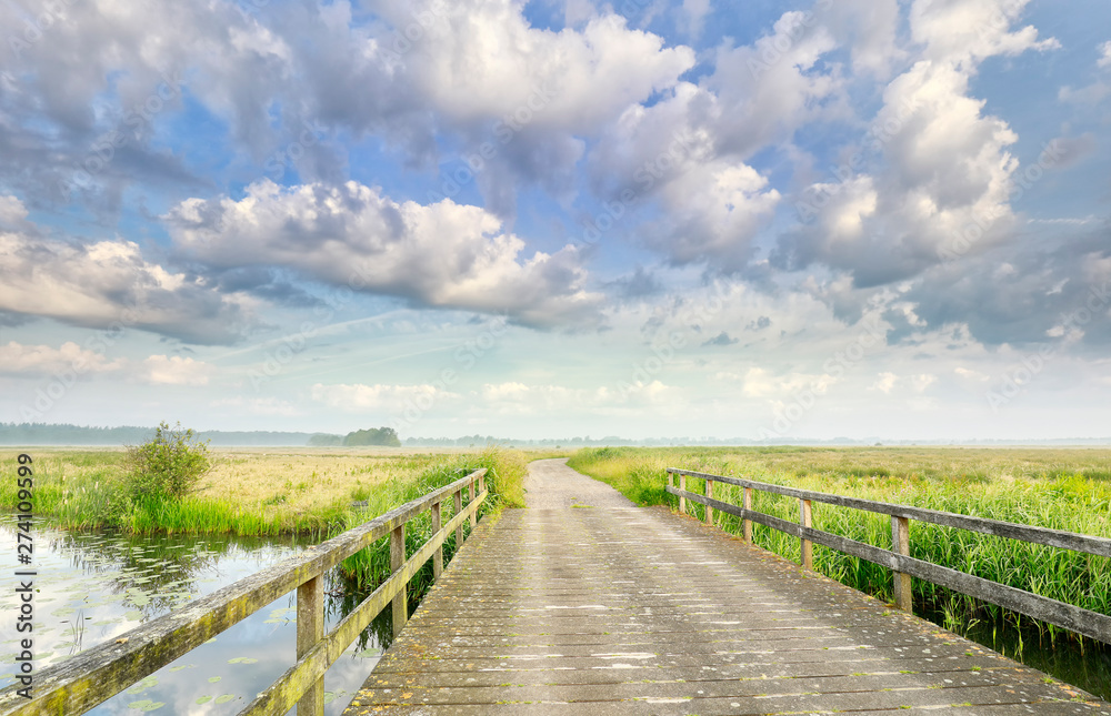 beautiful sky over wooden bridge in summer