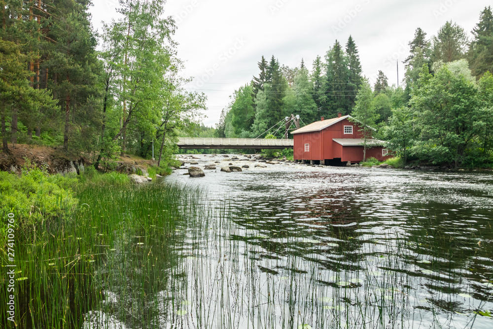 Fototapeta premium Old mill, dam and threshold on the river Jokelanjoki, Kouvola, Finland