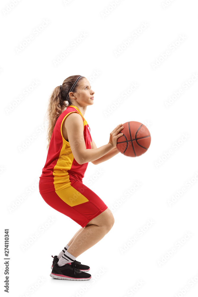 Woman basketball player shooting a ball