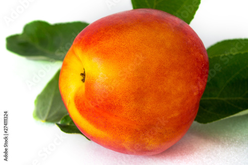 one fresh tasty peach on a white background