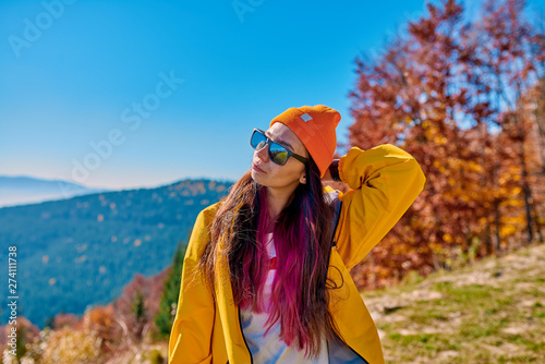 fashionable girl in the autumn forest