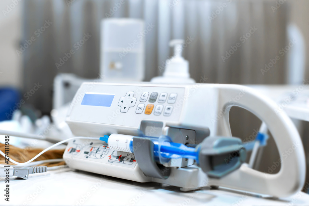 Equipment for anesthesia. Syringe pump for anasteria in the operating room. The operation in the veterinary clinic