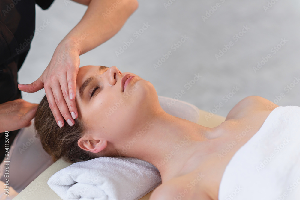 Handsome caucasian woman during spa treatment in the spa salon.