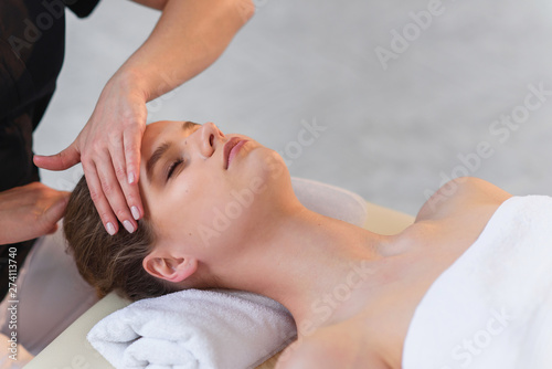 Handsome caucasian woman during spa treatment in the spa salon.