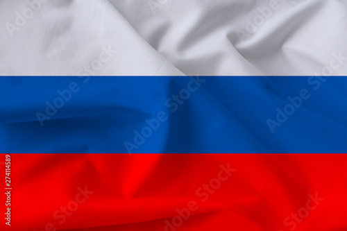 beautiful national flag of Russia on soft silk with soft folds close-up