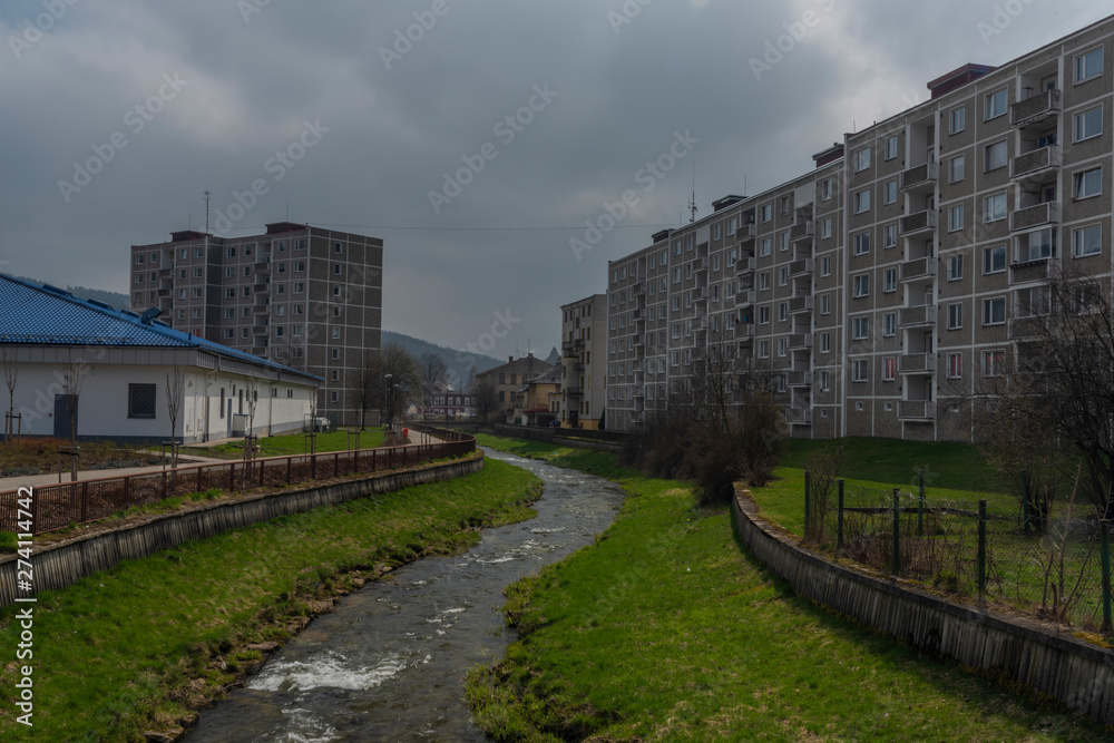 Block of flats in Kraslice town in soon spring cloudy day