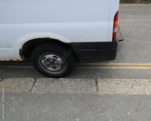 A white van parked illegally on a restricted parking zone. Double yellow lines on the road. No parking at any time.  © Scorsby