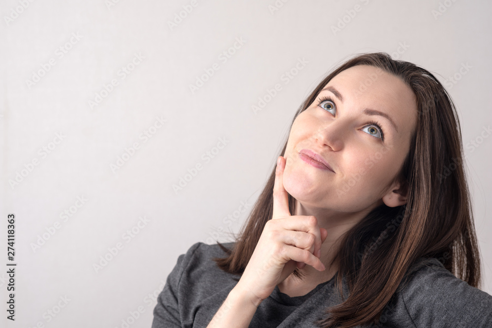 Large portrait of a young woman with a dreamy look. place for text Large portrait of a young woman with a dreamy look. place for text