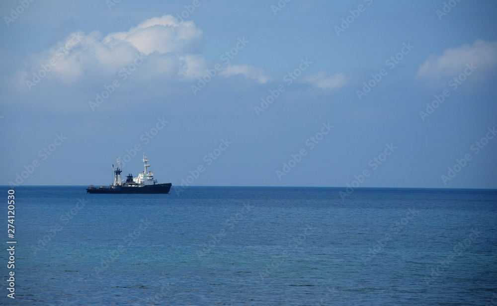 Sea, horizon, clouds and ship