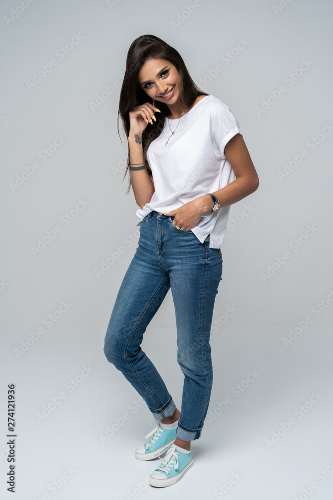 Full length portrait of a smiling pretty woman isolated over white background. Full length portrait of a smiling pretty woman isolated over white background.