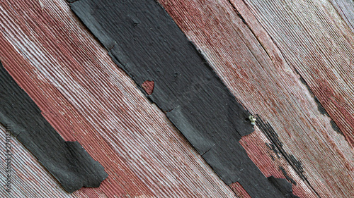 Backgrounds of weathered wood, chipped and flaking paint, gray s and reds photo