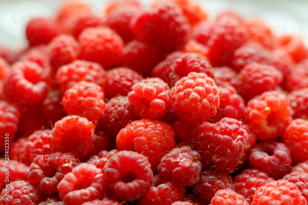 Heap of sweet red raspberries close up for bckground Heap of sweet red raspberries close up for bckground