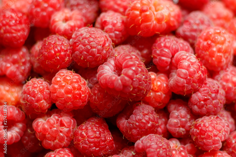 Heap of sweet red raspberries close up for background Heap of sweet red raspberries close up for background