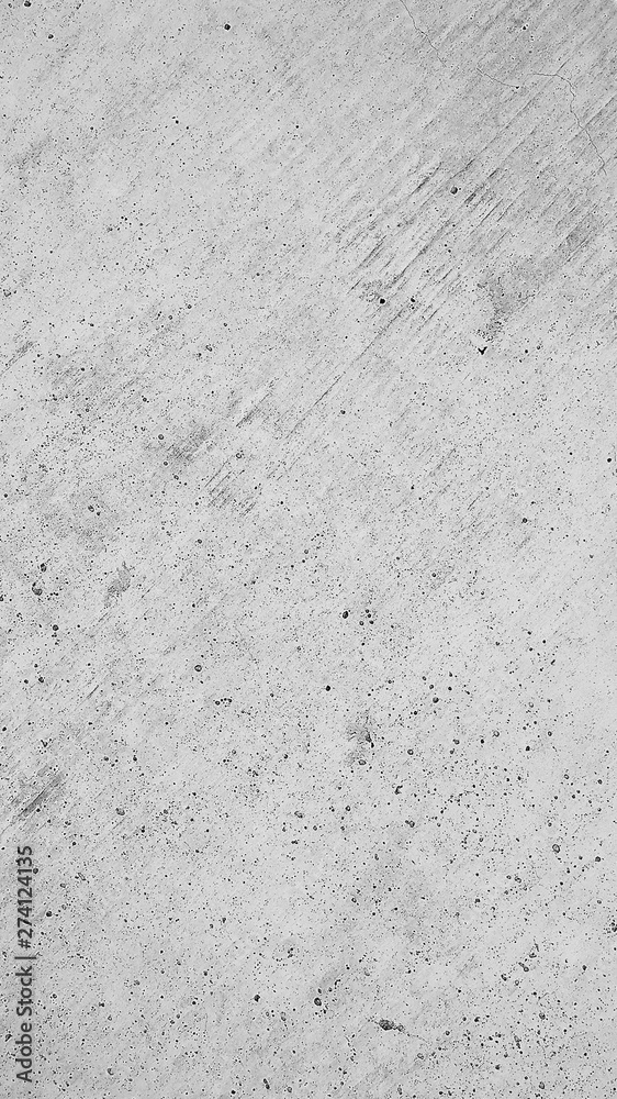 Fototapeta premium Graue Betonmauer, grauer Hintergrund mit Struktur, raue und kratzige muster im Industrial design. Steinmauer als grauer Hintergrund Hintergrund und Gestaltungselement.
