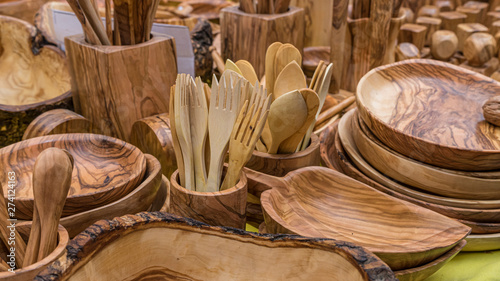 Kitchen wooden utensils for cooks. spoons, mallets, forks and cutlery handmade in handcrafted wood
