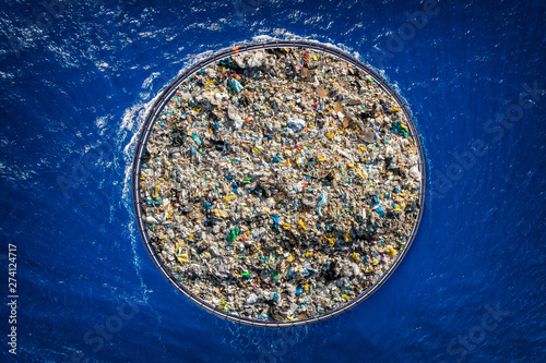 Concept cleaning ocean water from debris and plastic. Removing contaminants using ship and grid