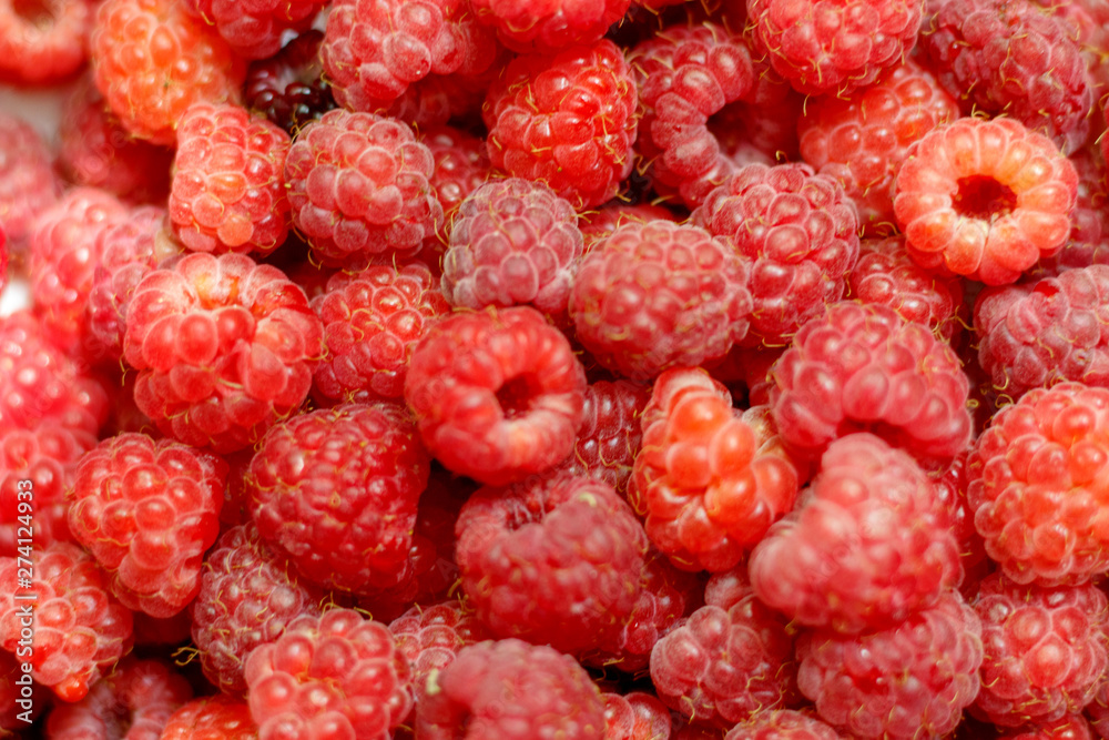 Heap of sweet red raspberries close up for background Heap of sweet red raspberries close up for background