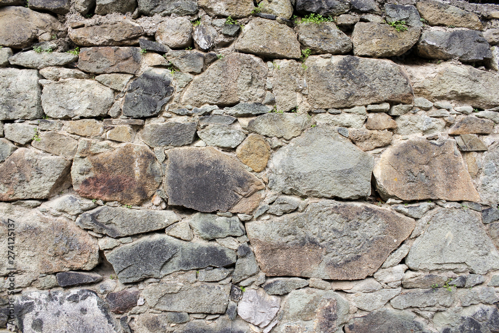 Background of the wall of natural stone. Background of the wall of natural stone.