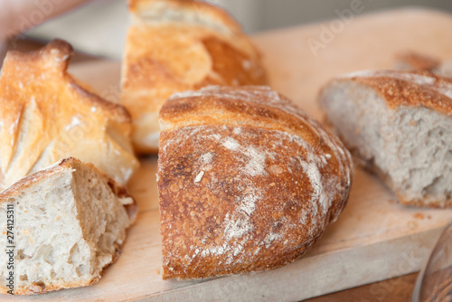 Sliced bread on wooden background, close up