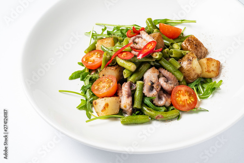 salad with baby octopus and vegetables