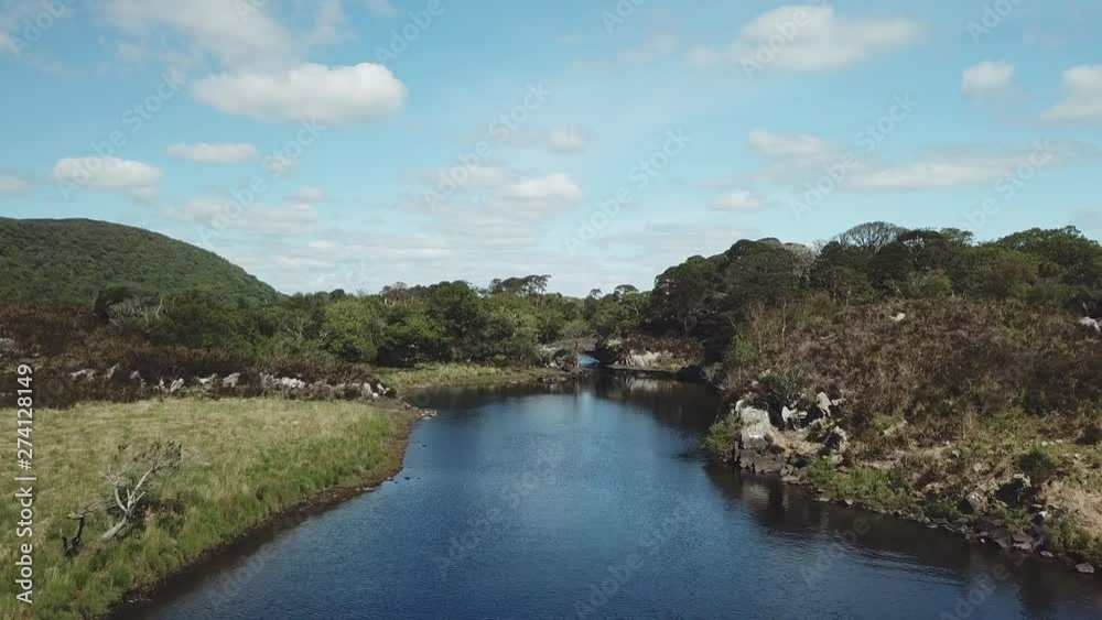 Old Weir Bridge in Killarney National Park, Ireland, Meeting of the two waters Old Weir Bridge in Killarney National Park, Ireland, Meeting of the two waters